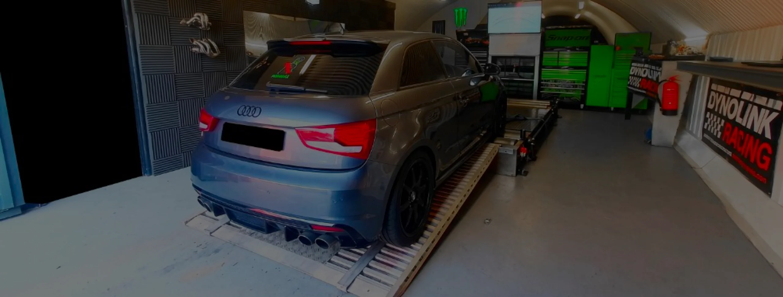 Audi A1 1.6 TDI Remap Bournemouth Poole Dorset | 24Tuning Grey Audi A1 rear three-quarter on Dynocom rolling road dyno at 24Tuning Bournemouth Dorset workshop for Stage 1 ECU remapping