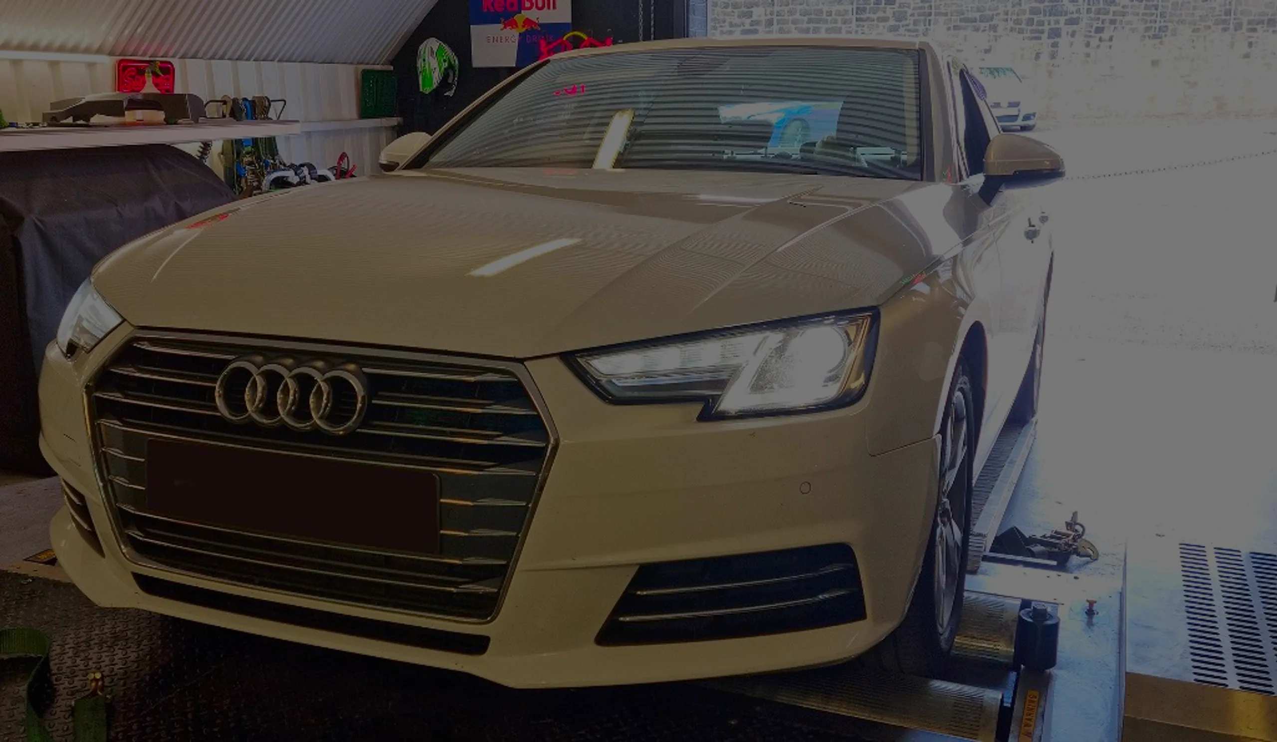 Audi A4 2.0 TDI B9 Remap Bournemouth Poole Dorset | 24Tuning White Audi A4 2.0 TDI B9 front three-quarter on rolling road dyno at 24Tuning Bournemouth Dorset workshop for Stage 1 ECU remapping
