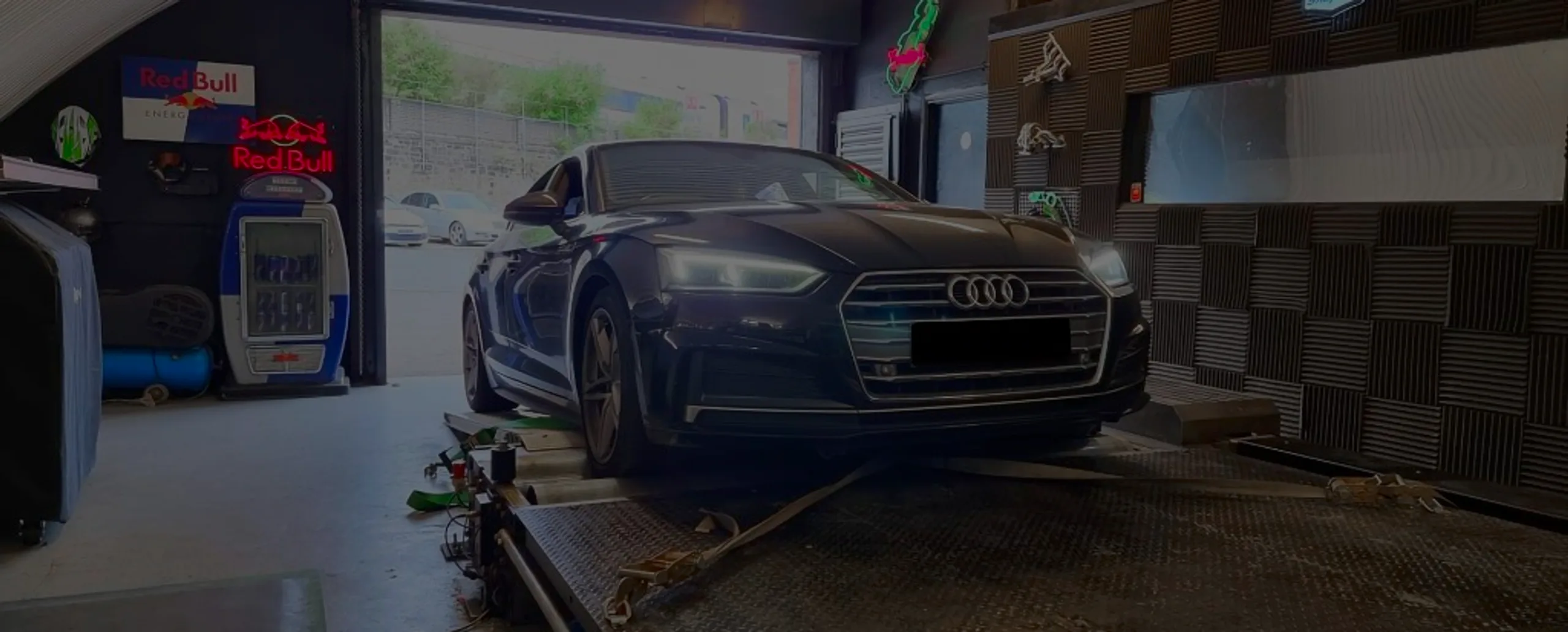 Black Audi A5 2.0 TDI F5 front view on rolling road dyno at 24Tuning Bournemouth Dorset workshop for Stage 1 ECU remapping
