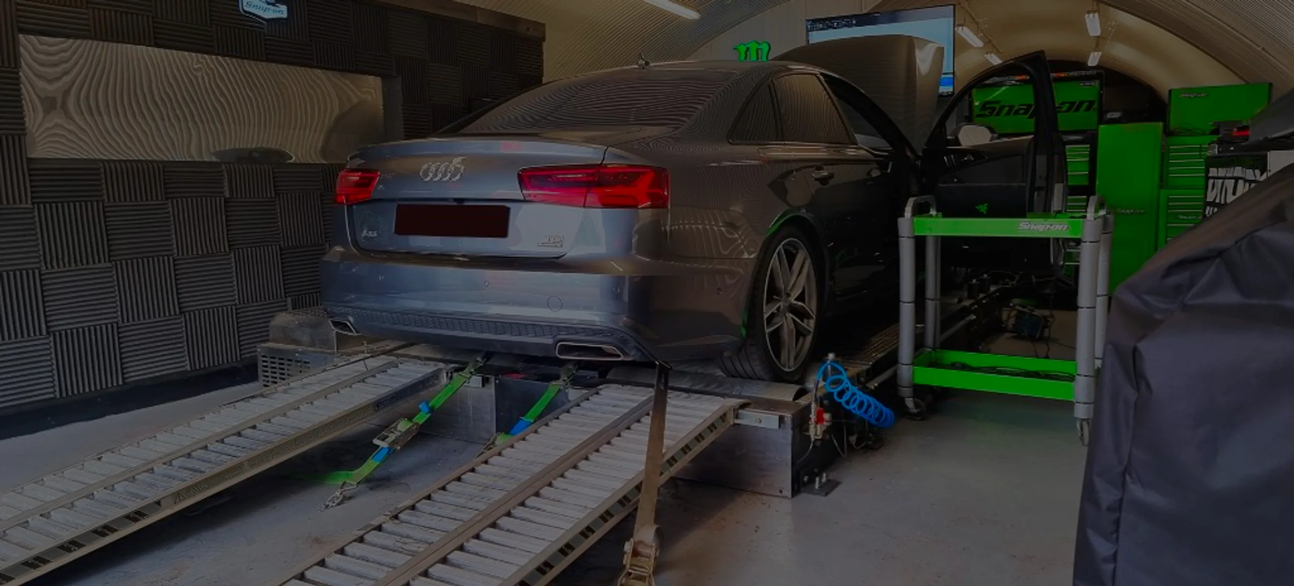 Grey Audi A6 2.0 TDI C7 rear three-quarter on rolling road dyno with bonnet and door open at 24Tuning Bournemouth Dorset workshop for Stage 1 ECU remapping