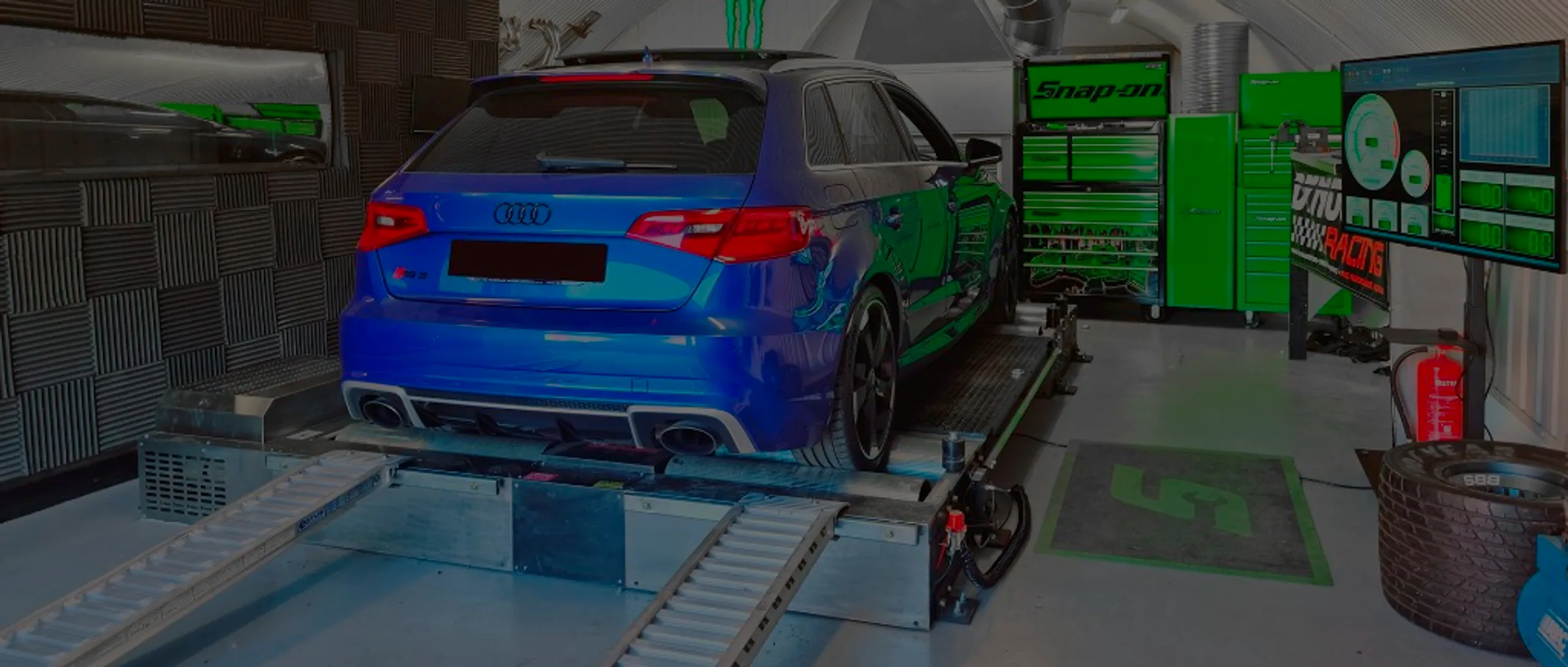 Audi RS3 2.5 TFSI 8V Remap Bournemouth Poole Dorset | 24Tuning Blue Audi RS3 2.5 TFSI 8V front three-quarter on Dynocom rolling road dyno at 24Tuning Bournemouth Dorset workshop for Stage 1 ECU remapping