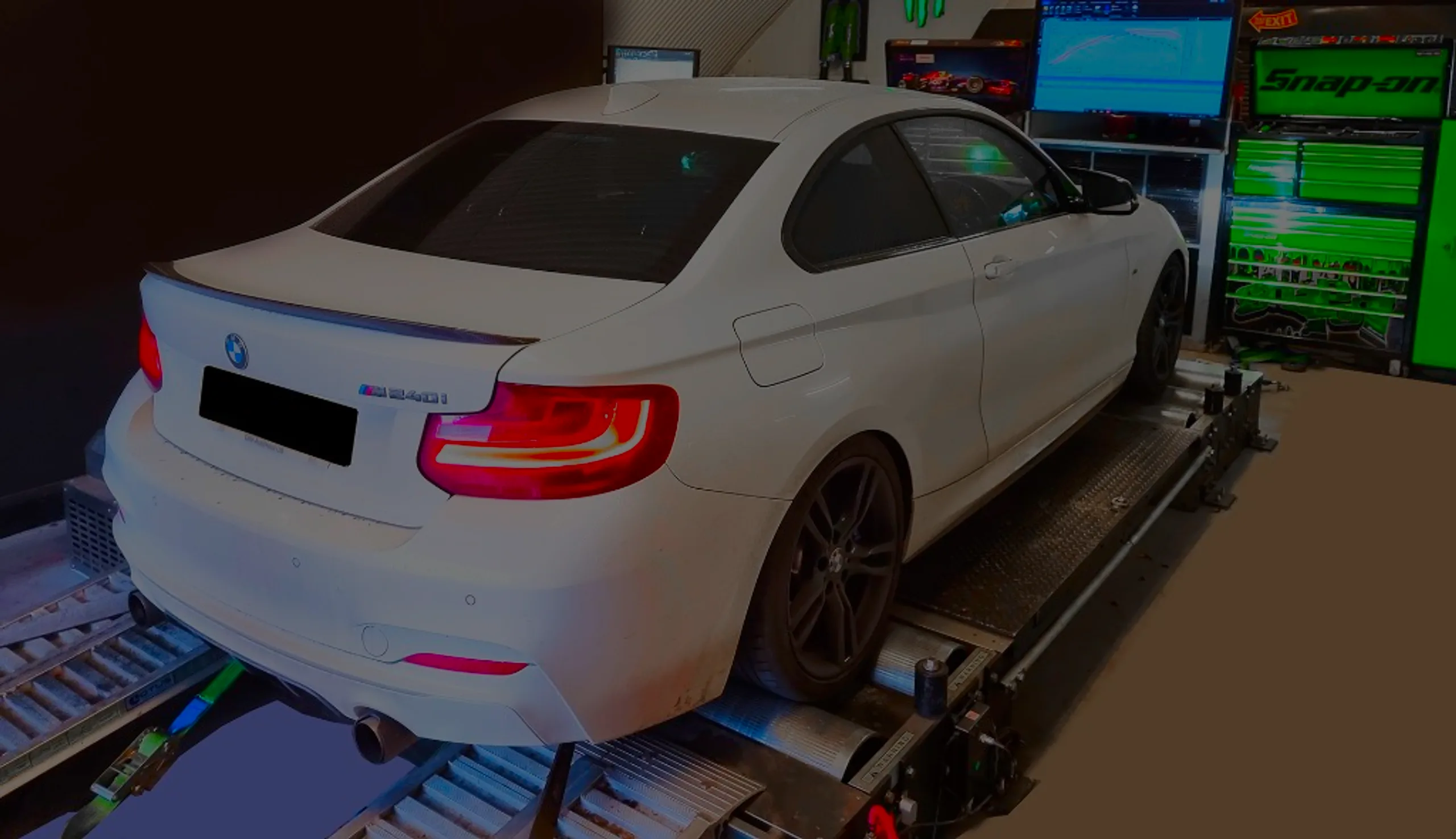 White BMW M240i F23 rear three-quarter on rolling road dyno at 24Tuning Bournemouth Dorset workshop for Stage 1 ECU remapping