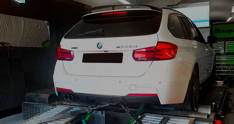 White BMW 3 Series F31 Touring rear on rolling road dyno during ECU remap testing at 24Tuning Bournemouth Dorset