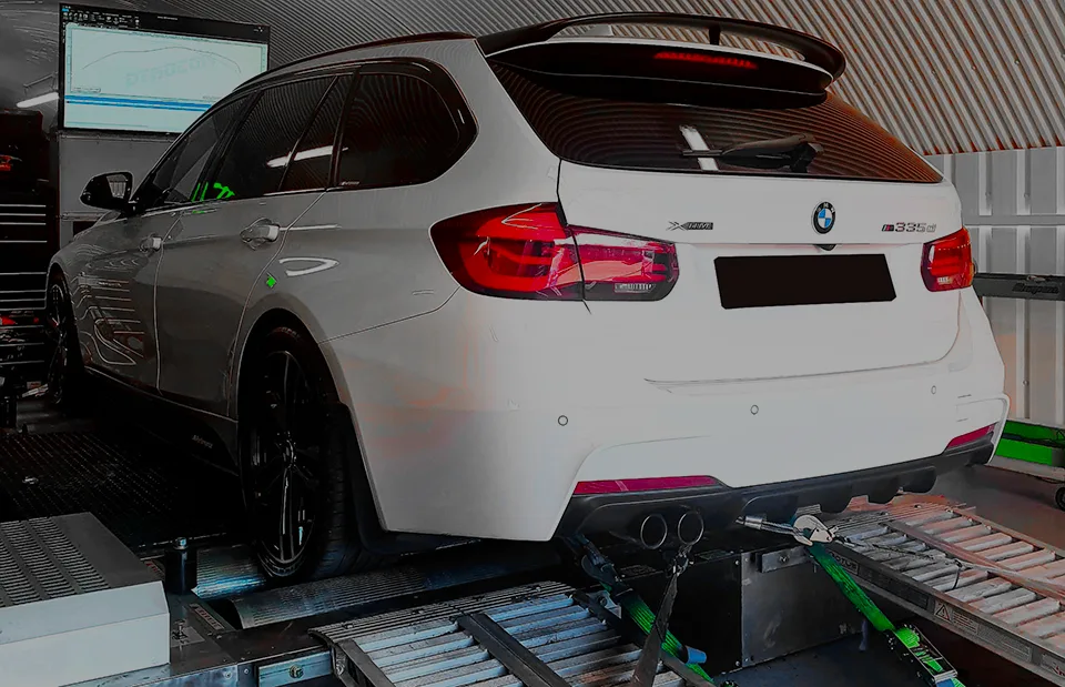 White BMW 3 Series F31 Touring rear three-quarter on Dynocom rolling road dyno at 24Tuning Bournemouth Dorset