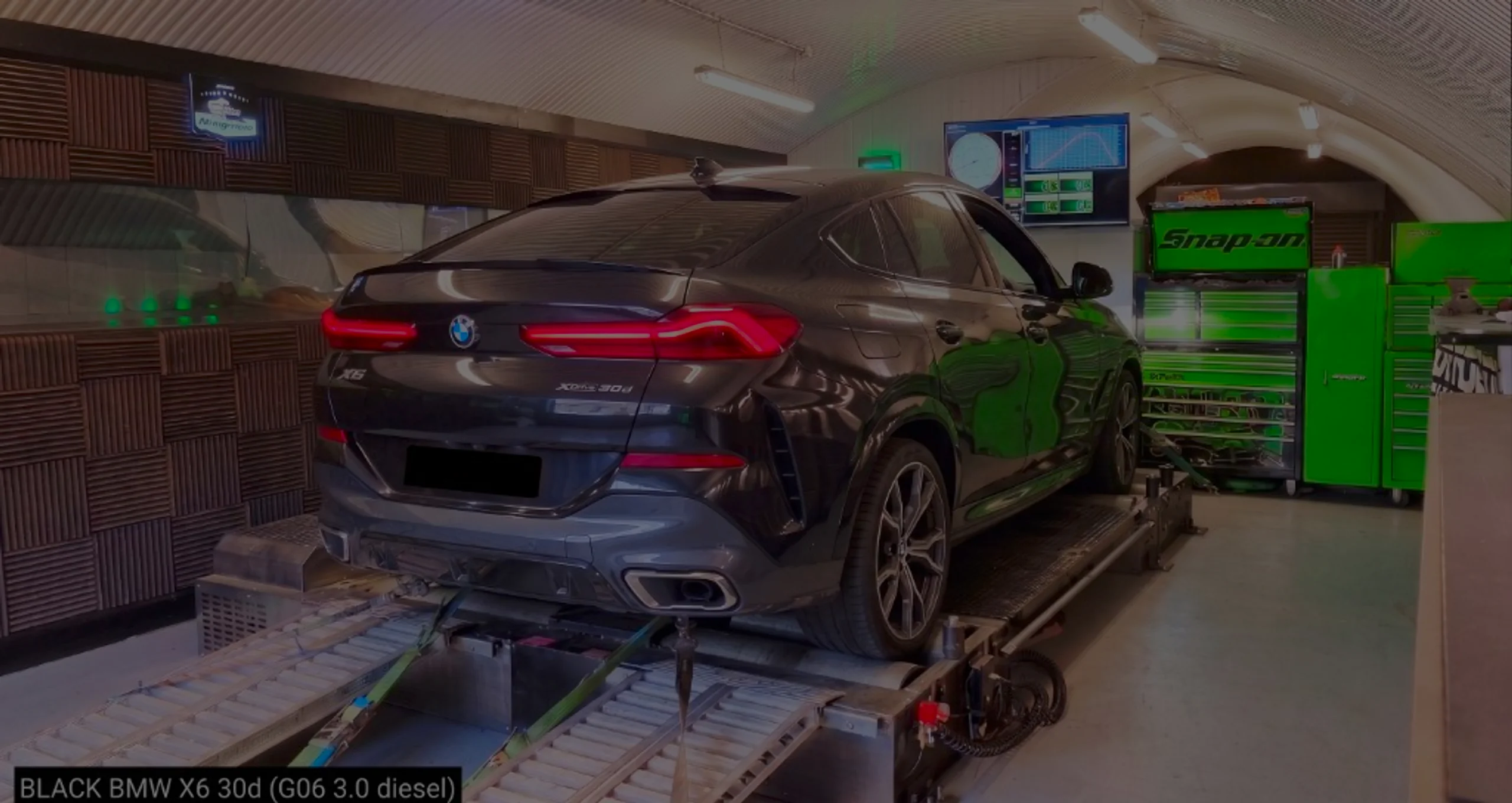 Black BMW X6 xDrive30d G06 wide panoramic rear on Dynocom rolling road dyno at 24Tuning Bournemouth Dorset workshop for Stage 1 diesel ECU remapping
