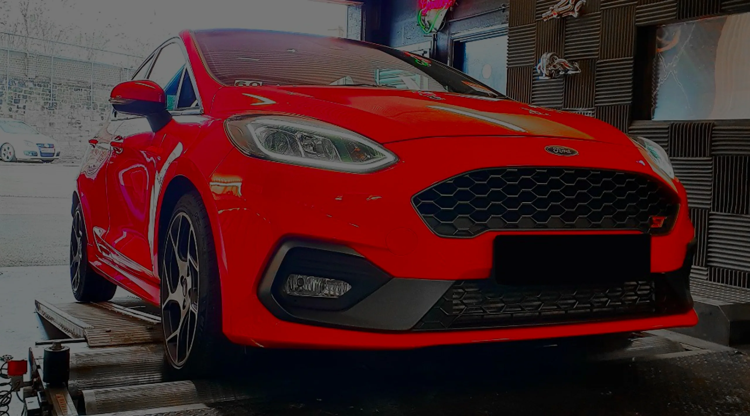 Ford Fiesta ST 1.5 EcoBoost Remap Bournemouth Poole Dorset | 24Tuning Red Ford Fiesta ST 1.5 EcoBoost front three-quarter on Dynocom rolling road dyno at 24Tuning Bournemouth Dorset workshop for Stage 1 ECU remapping