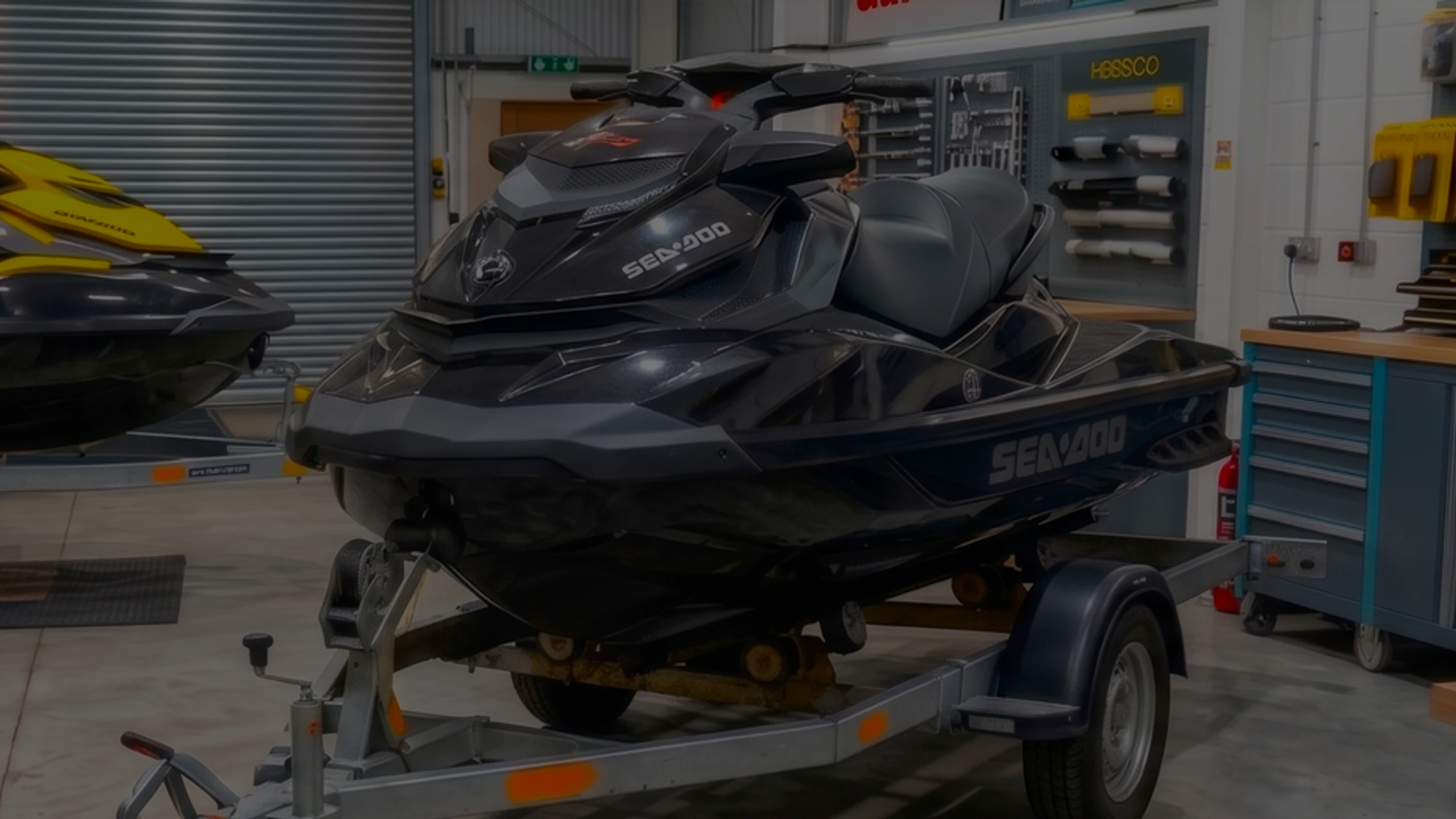 Black Sea-Doo jet ski on a trailer in the 24Tuning Bournemouth Dorset workshop for ECU remapping and PWC tuning
