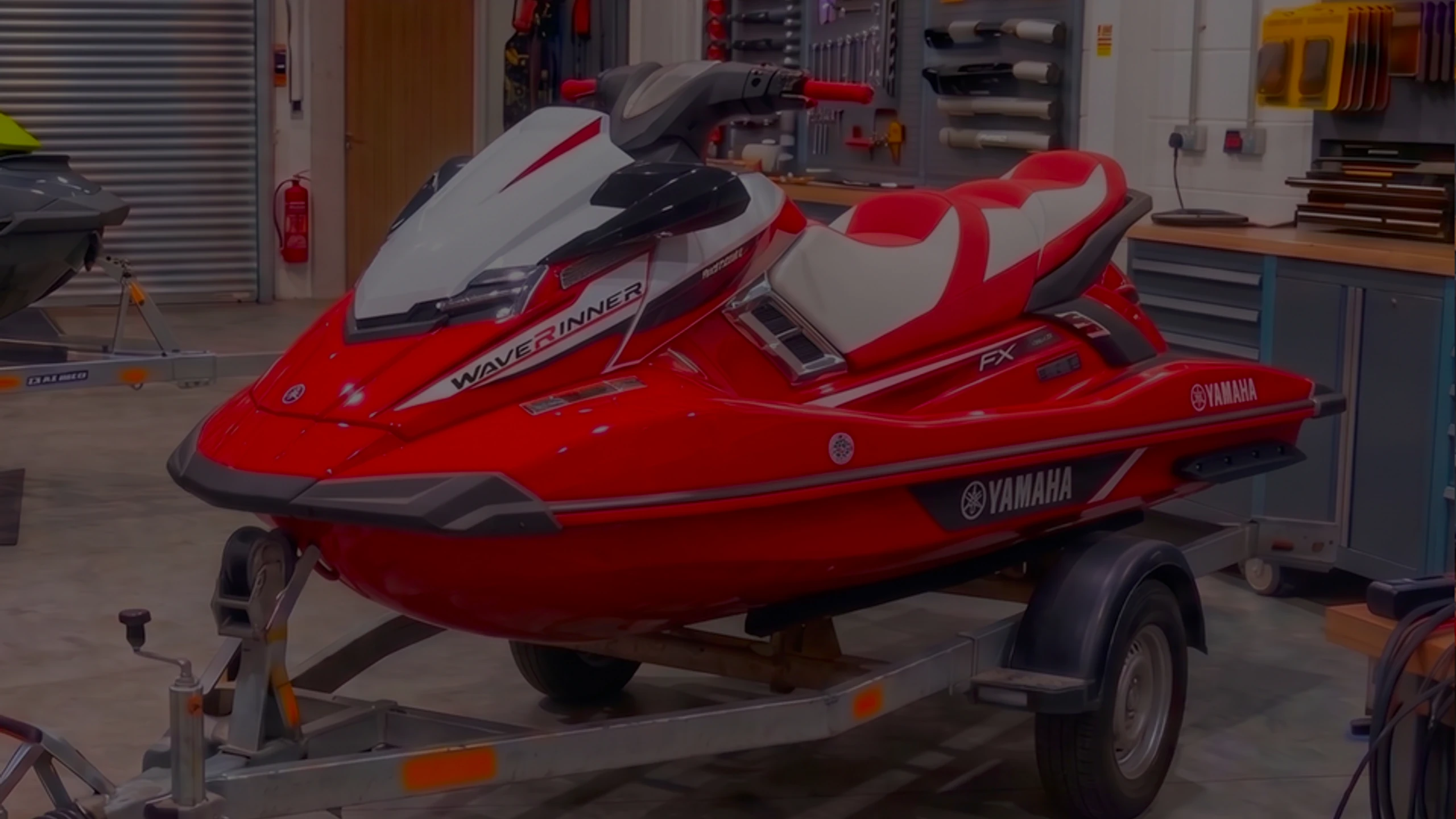 Red and white Yamaha WaveRunner FX jet ski on a trailer in the 24Tuning Bournemouth Dorset workshop for ECU remapping and PWC tuning