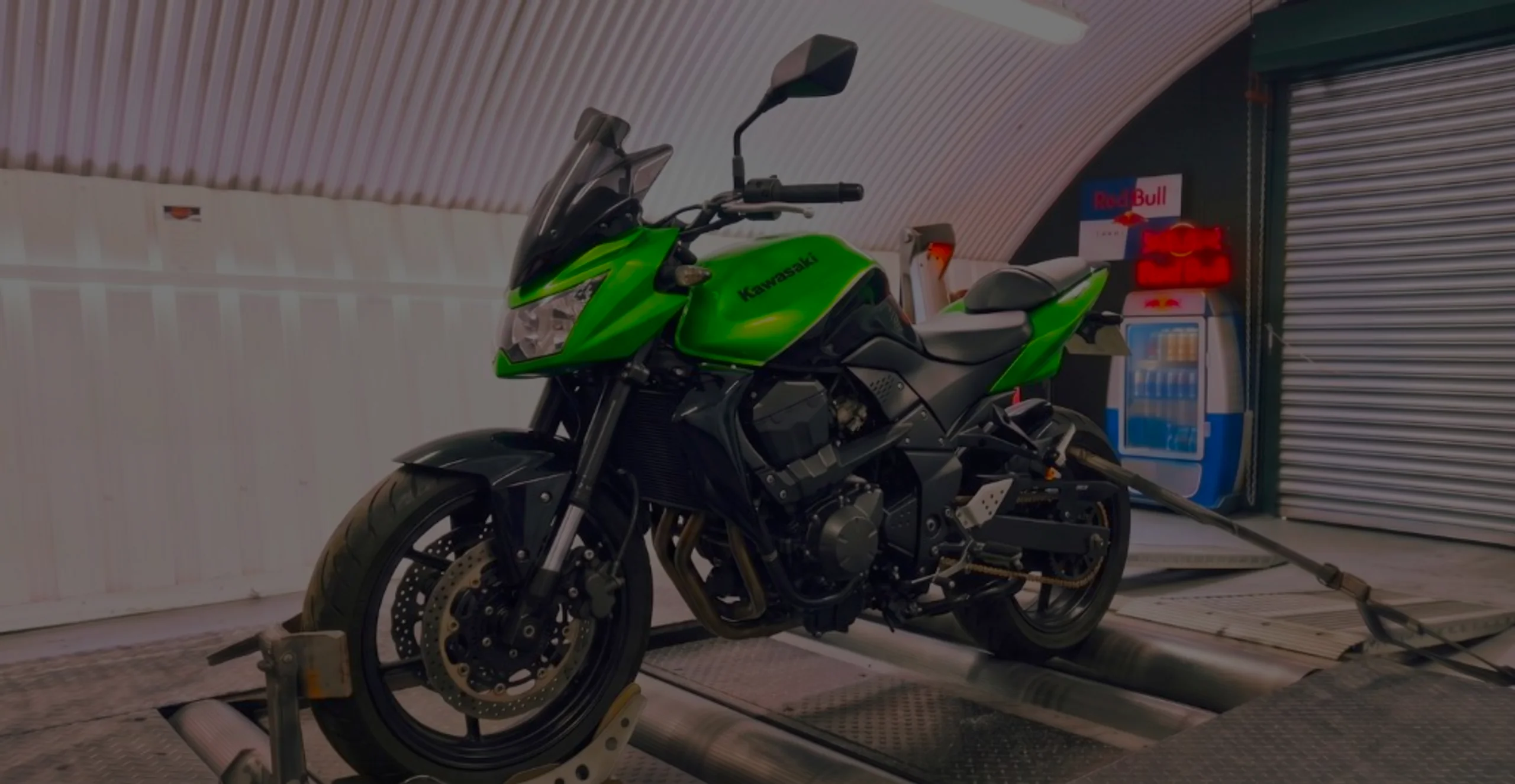 Kawasaki ZR750 Remap Bournemouth Poole Dorset | 24Tuning Lime green Kawasaki ZR750 front three-quarter on motorcycle rolling road dyno with Kawasaki tank lettering at 24Tuning Bournemouth Dorset workshop for Stage 1 ECU remapping