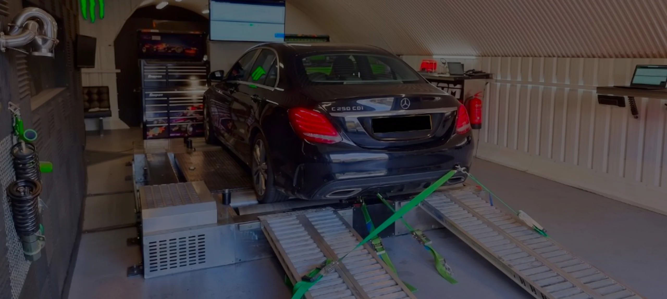 Black Mercedes-Benz C250 CDI W205 wide panoramic on Dynocom rolling road dyno at 24Tuning Bournemouth Dorset workshop for Stage 1 diesel ECU remapping