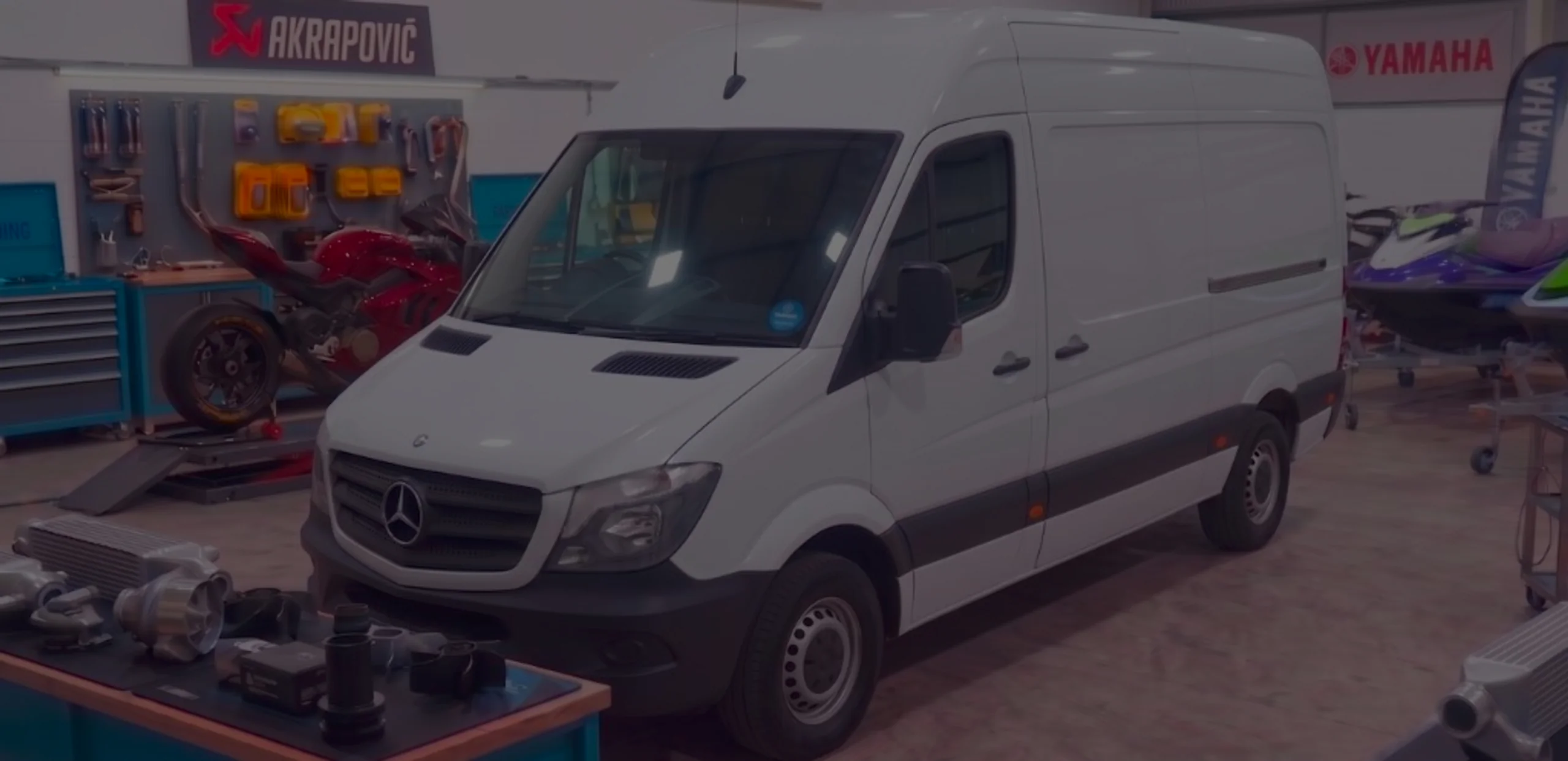 White Mercedes-Benz Sprinter W906 front three-quarter in 24Tuning Bournemouth Dorset workshop with Mercedes star badge for Stage 1 ECU remapping