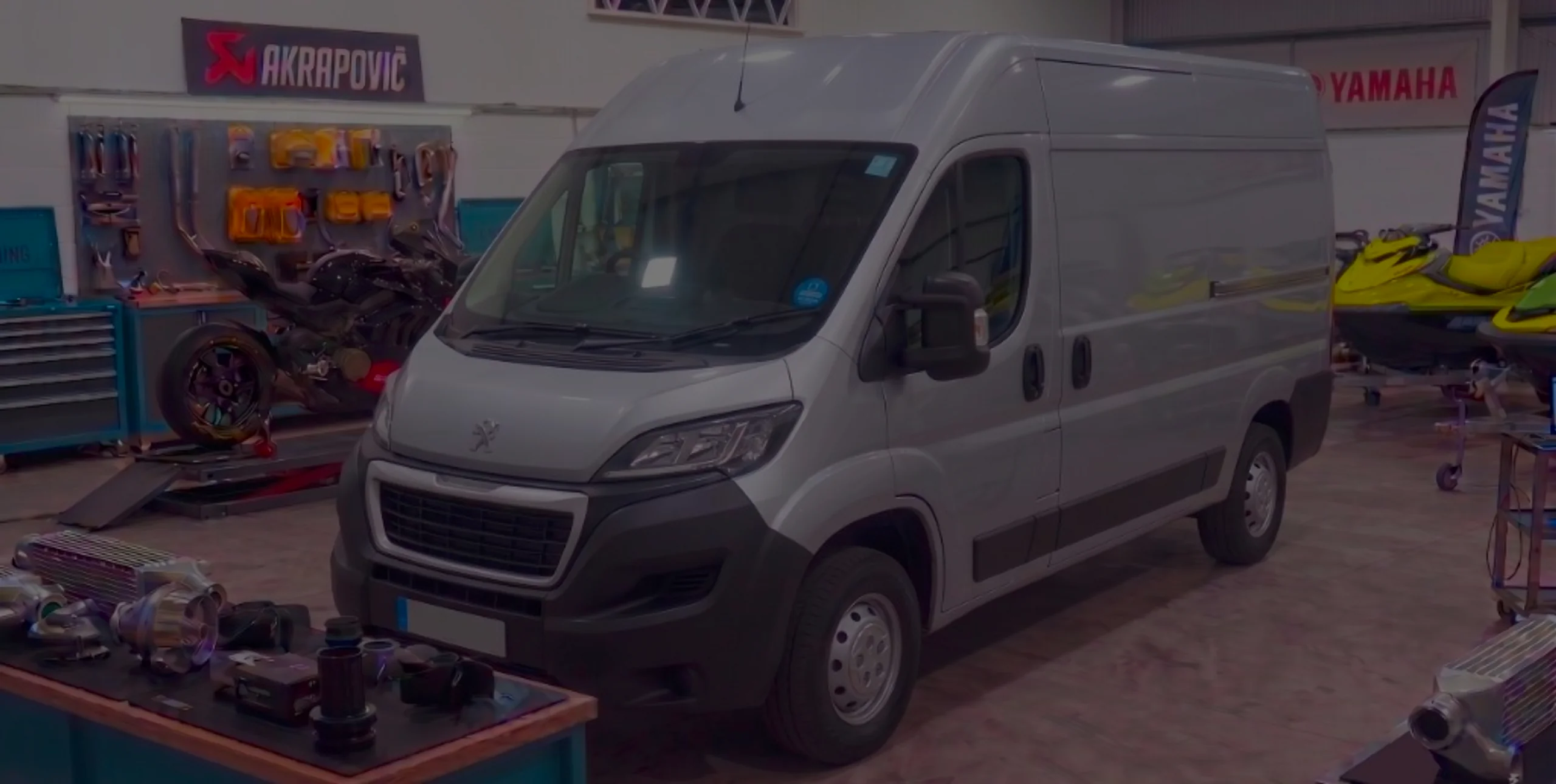 Silver Peugeot Boxer front three-quarter in 24Tuning Bournemouth Dorset workshop with Peugeot lion badge for Stage 1 ECU remapping