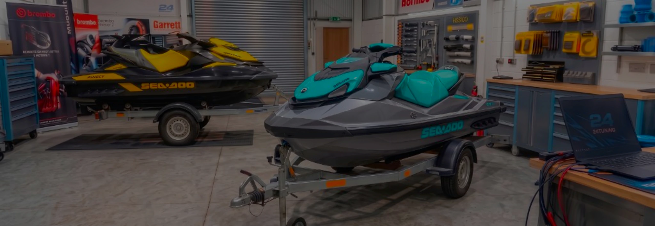 Sea-Doo GTI 1500 Remap Bournemouth Poole Dorset | 24Tuning Grey and teal Sea-Doo GTI jet ski on a trailer in the 24Tuning Bournemouth Dorset workshop with ECU remapping laptop and tuning cables for Stage 1 calibration