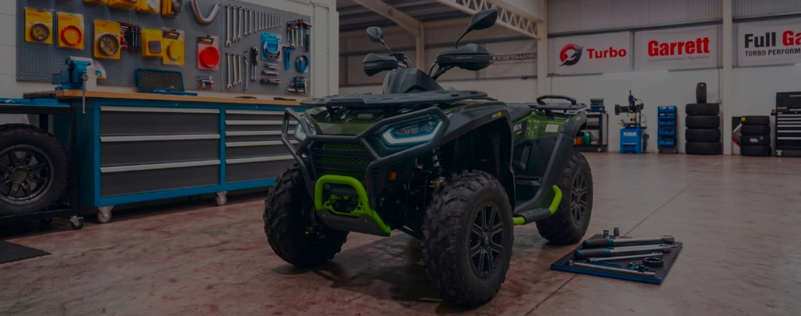 Segway Snarler AT6 Remap Bournemouth Poole Dorset | 24Tuning Olive green and lime Segway Snarler AT6 in 24Tuning Bournemouth Dorset workshop with tool chest, Garrett turbo banner and torque wrenches for Stage 1 ECU remapping