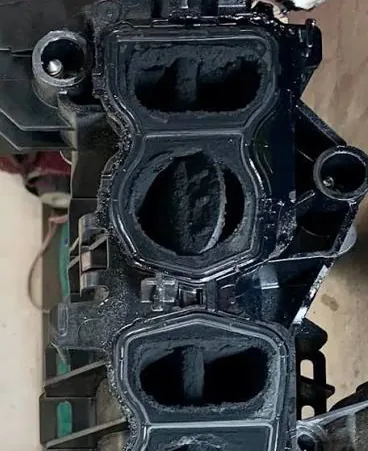 Heavily carbon-clogged intake manifold ports with stuck swirl flaps — Bournemouth Dorset