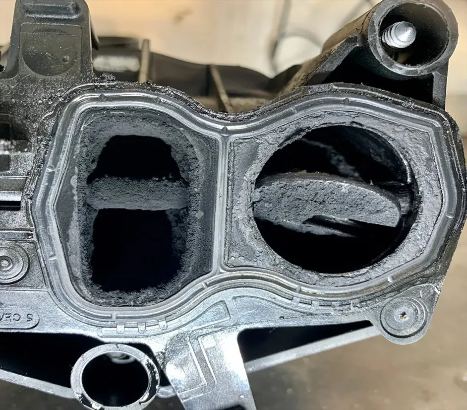Clogged Swirl Flap Manifold | 24Tuning Two intake ports with swirl flaps heavily clogged in carbon deposits — Bournemouth Dorset