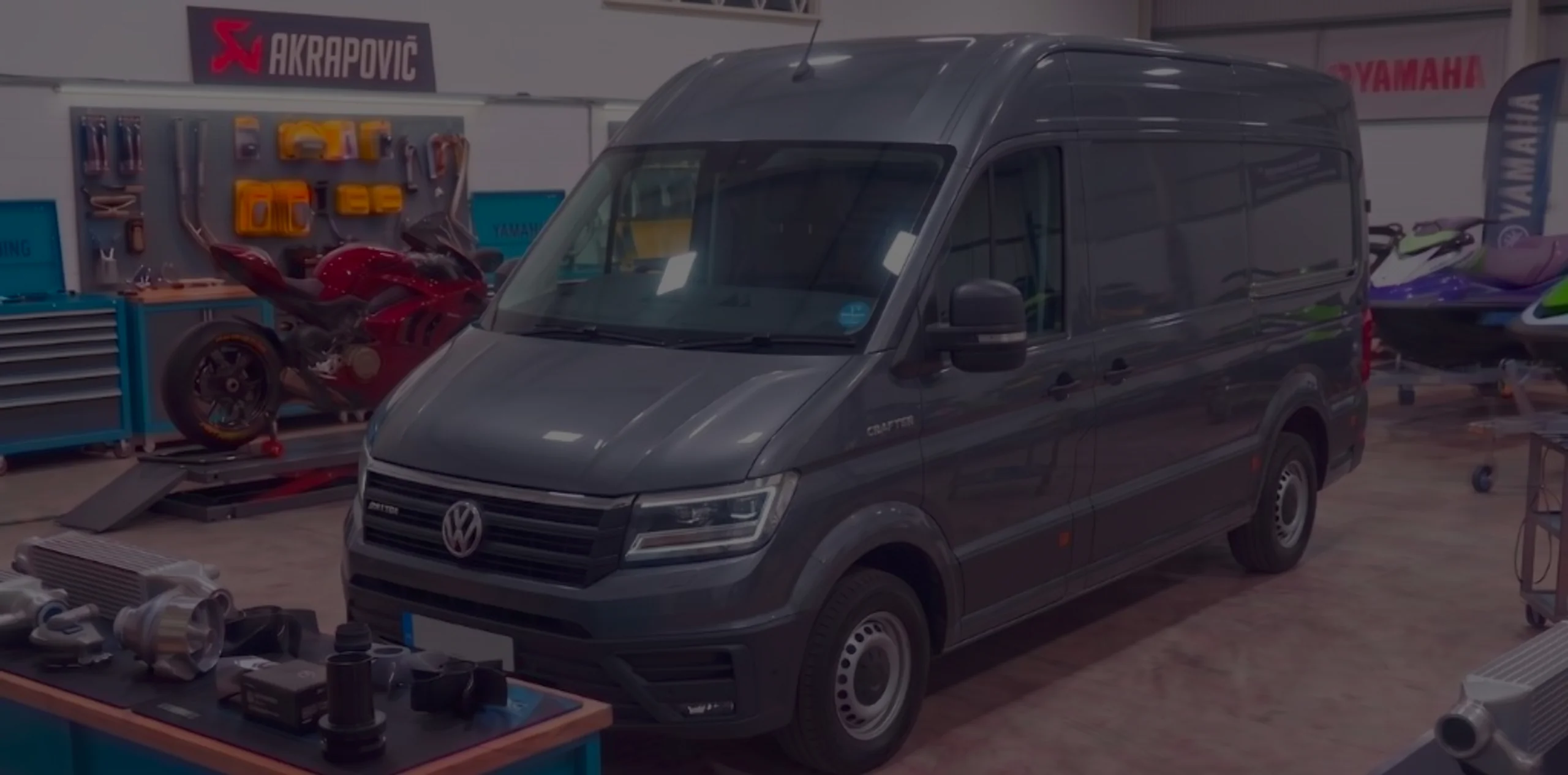 VW Crafter 2.0 TDI SY Remap Bournemouth Poole Dorset | 24Tuning Dark grey Volkswagen Crafter front three-quarter in 24Tuning Bournemouth Dorset workshop with VW badge for Stage 1 ECU remapping
