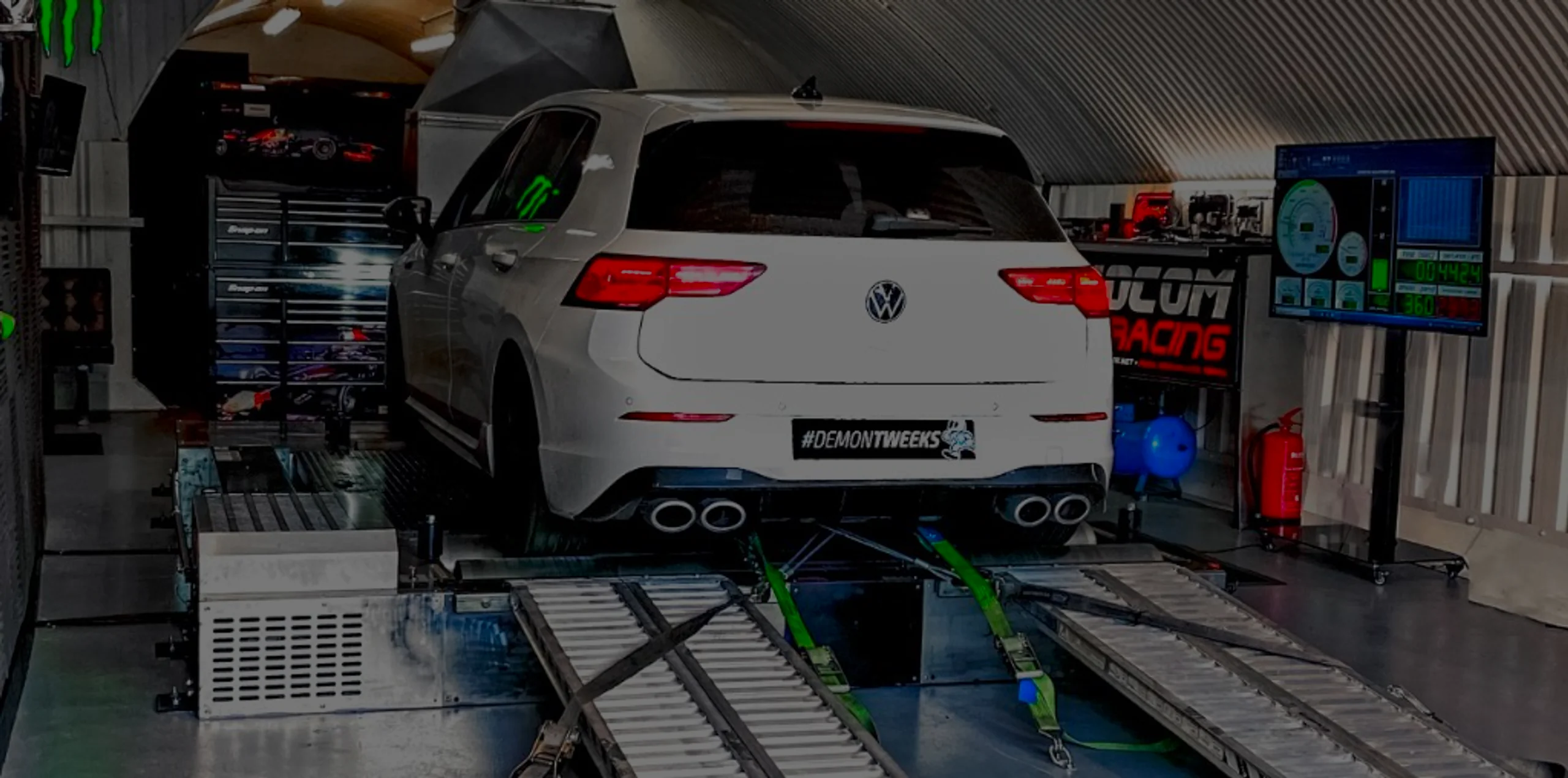 White Volkswagen Golf GTI Mk8 wide panoramic rear on Dynocom rolling road dyno with tuning monitor at 24Tuning Bournemouth Dorset workshop for Stage 1 ECU remapping