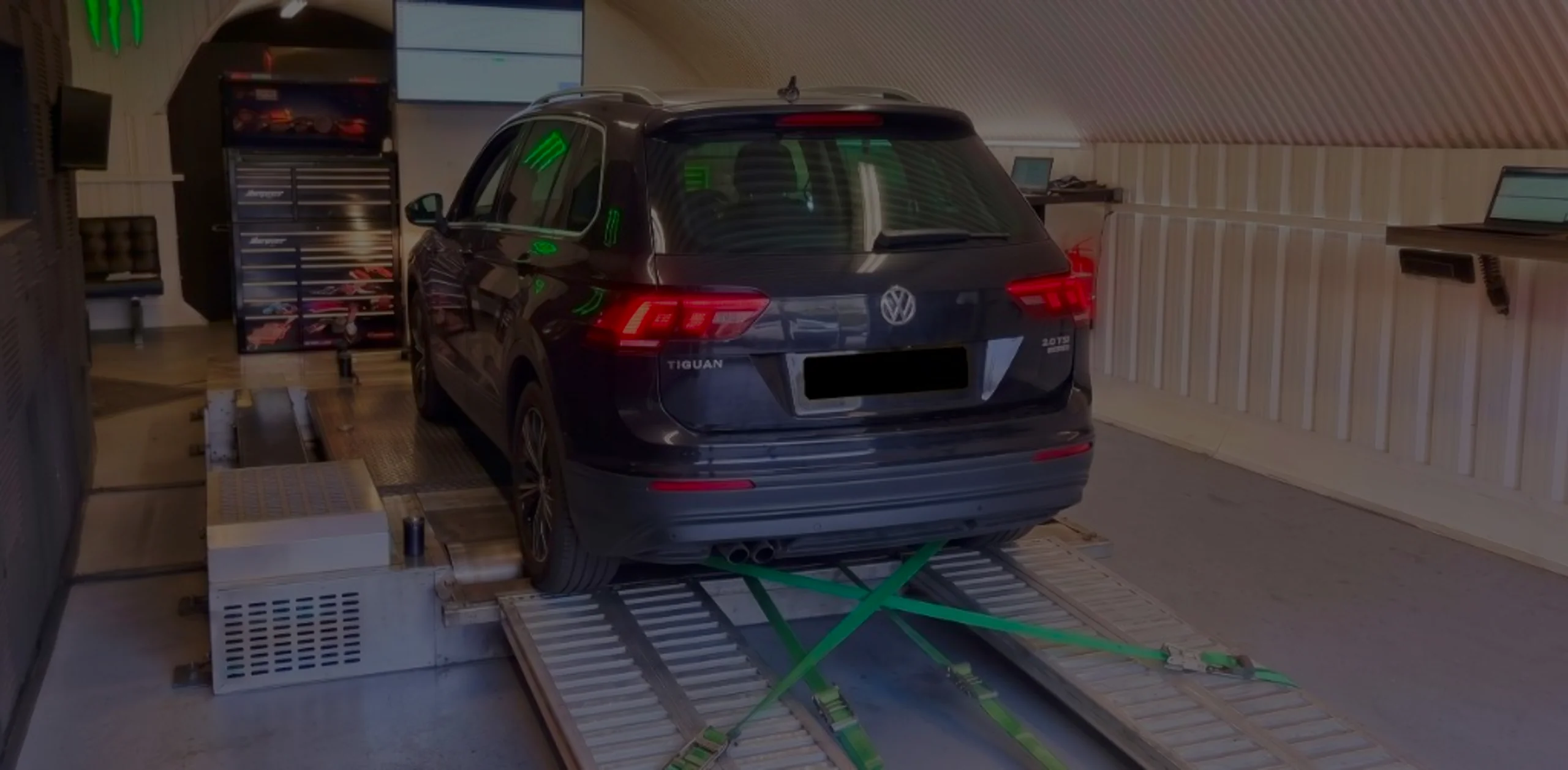 Dark grey Volkswagen Tiguan Mk2 wide panoramic rear on Dynocom rolling road dyno at 24Tuning Bournemouth Dorset workshop for Stage 1 diesel ECU remapping