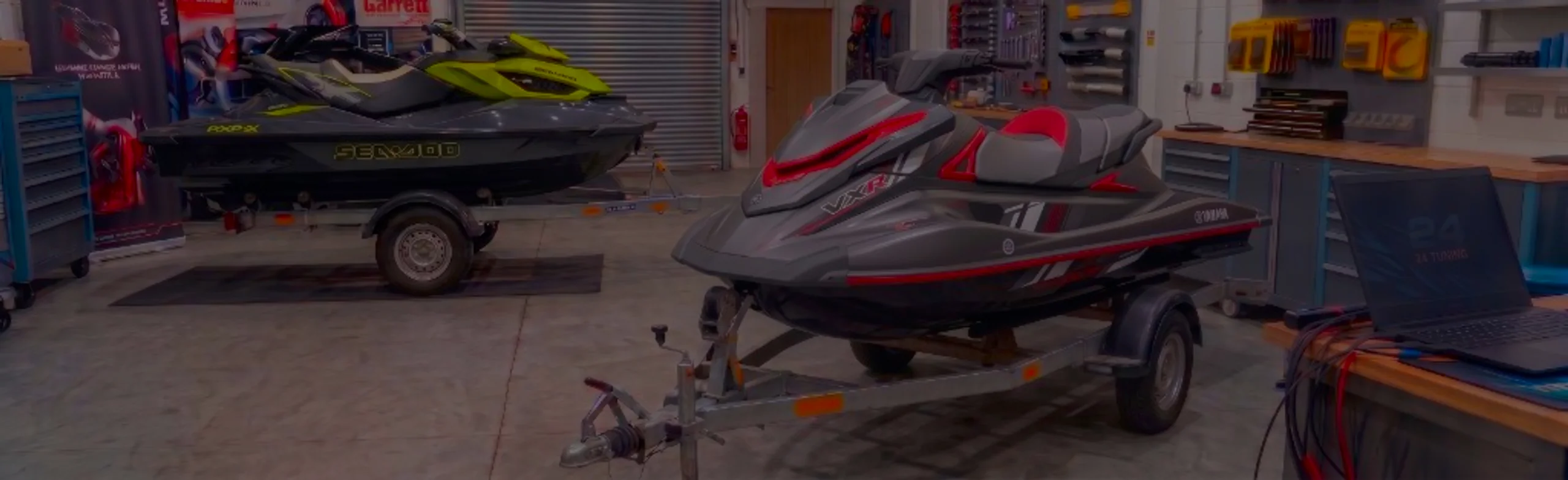 Yamaha VX R Remap Bournemouth Poole Dorset | 24Tuning Grey red and white Yamaha VXR WaveRunner on a trailer in the 24Tuning Bournemouth Dorset workshop with ECU remapping laptop and tuning cables for Stage 1 PWC calibration