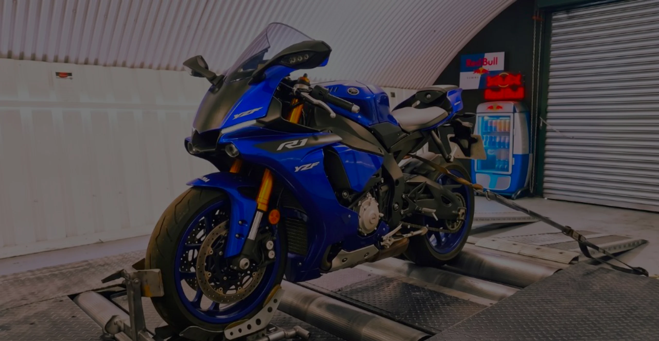 Yamaha YZF R1 Remap Bournemouth Poole Dorset | 24Tuning Yamaha Racing Blue YZF-R1 front three-quarter on motorcycle rolling road dyno with R1 and YZF fairing decals at 24Tuning Bournemouth Dorset workshop for Stage 1 ECU remapping